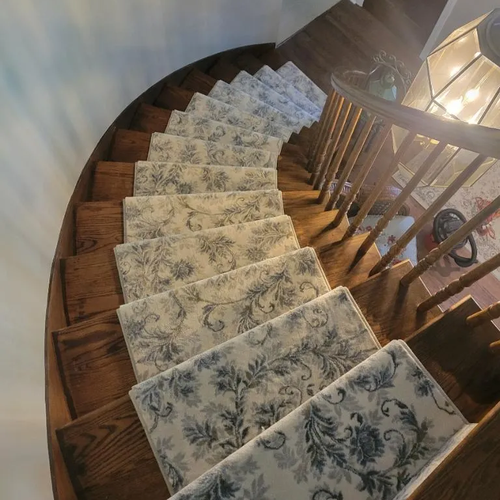 Light carpet stair runner installed by McCools Flooring