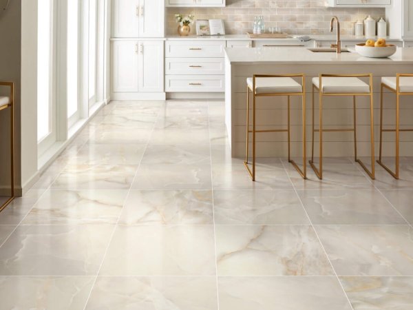 Modern kitchen with marble tile flooring and gold accents