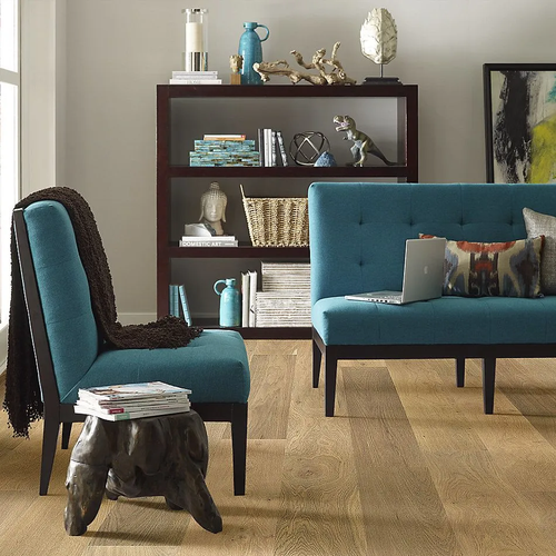 Hardwood flooring in a home with blue accent decor