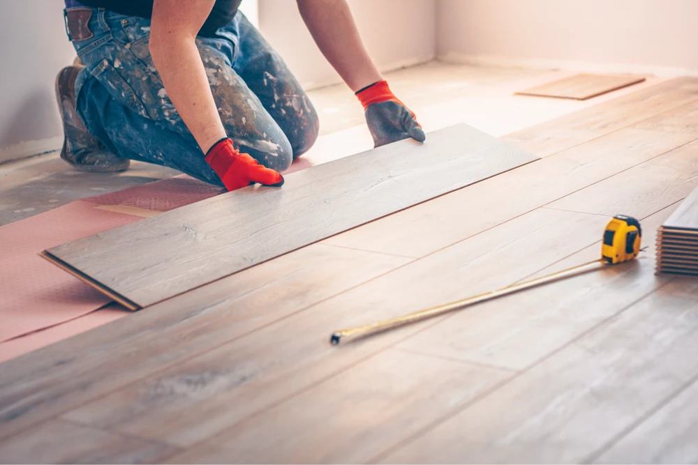 Flooring professional installing laminate floors