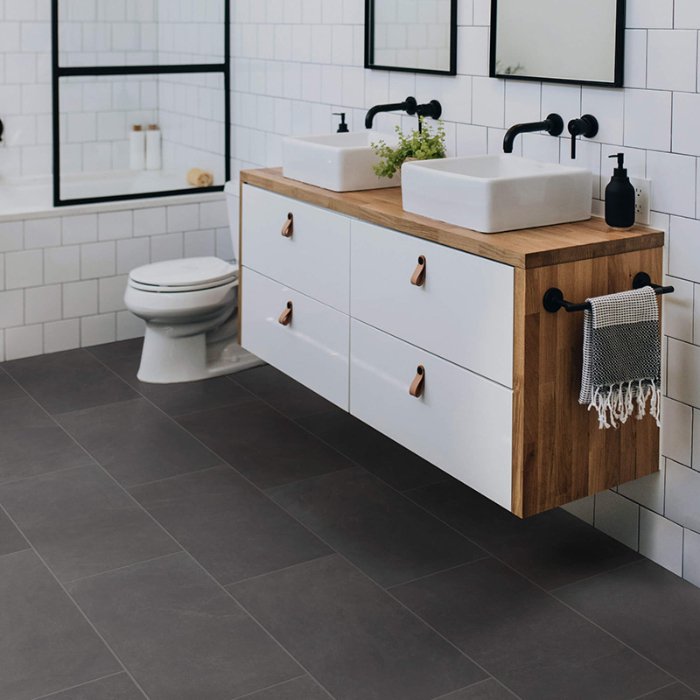 Modern and trendy bathroom with dark slip resistant tile floors