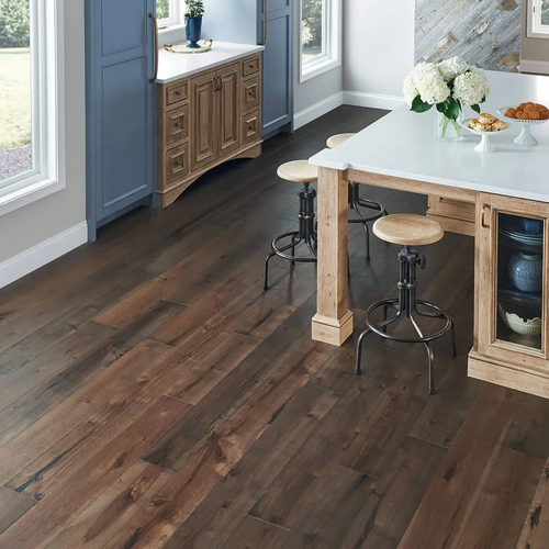 Dark hardwood flooring in a bright kitchen
